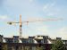 Liebherr static crane towering over residential buildings