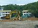 Kobelco excavator at parking lot site